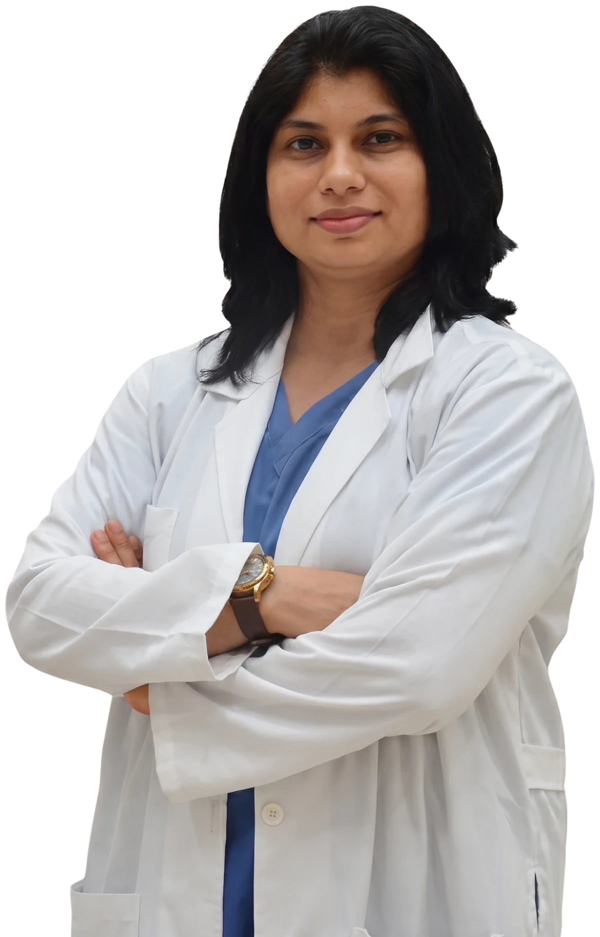 Dr. Neema Bhat in a white coat over blue scrubs, arms folded